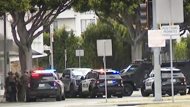 Armed man barricaded inside a vehicle after Beverly Hills police pursuit; hostage released